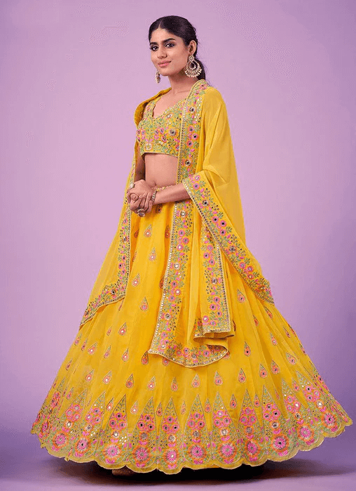 Yellow Haldi Wear Mirror Work Georgette Lehenga Choli