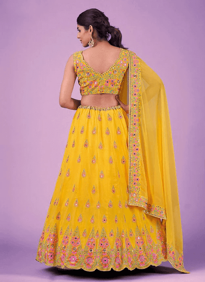 Yellow Haldi Wear Mirror Work Georgette Lehenga Choli